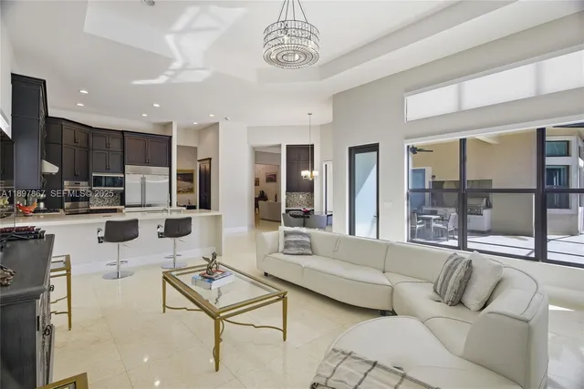a living room with fireplace furniture and a flat screen tv