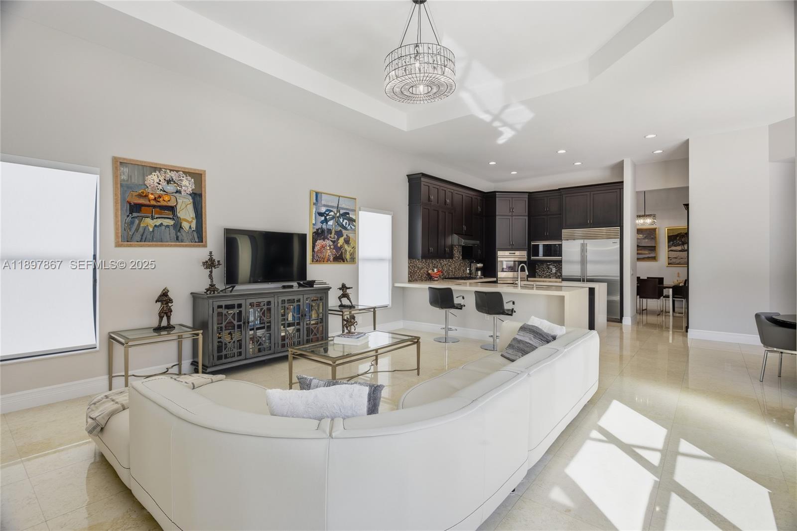 9772 Rennes Lane Delray Beach, FL 33446 - Photo 9 of 59 a living room with fireplace furniture and a flat screen tv