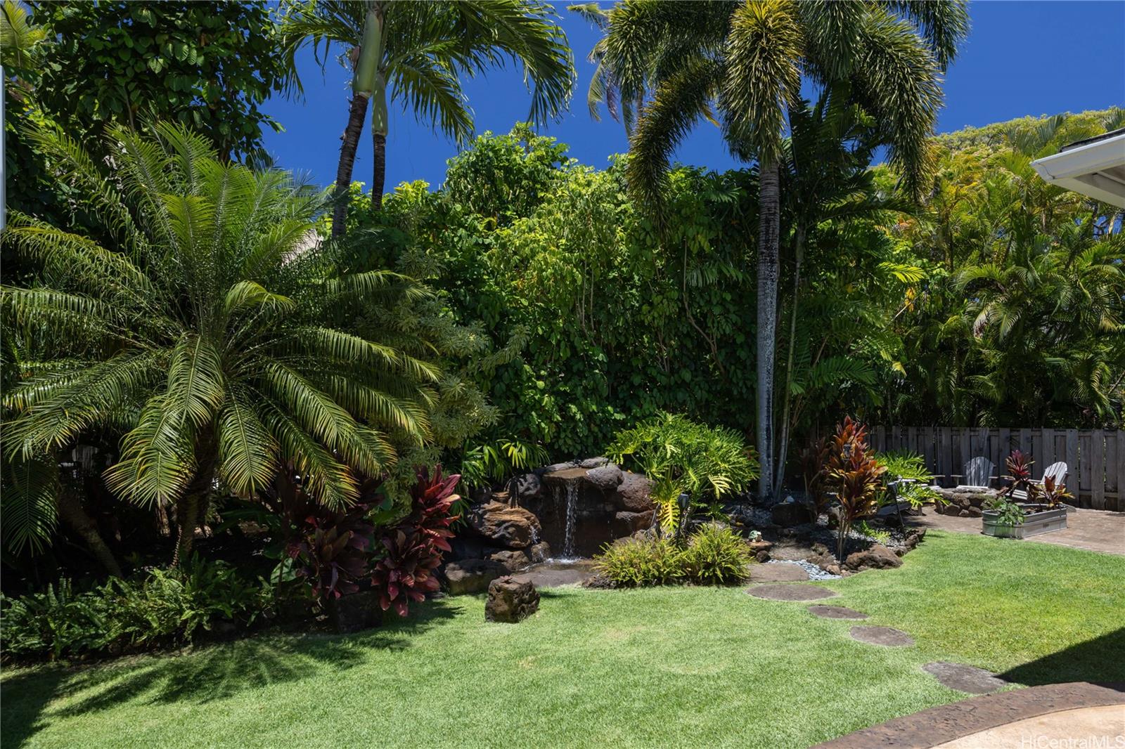 409 Wanaao Road Kailua, HI 96734 - Photo 25 of 25 a view of backyard with plants and outdoor seating