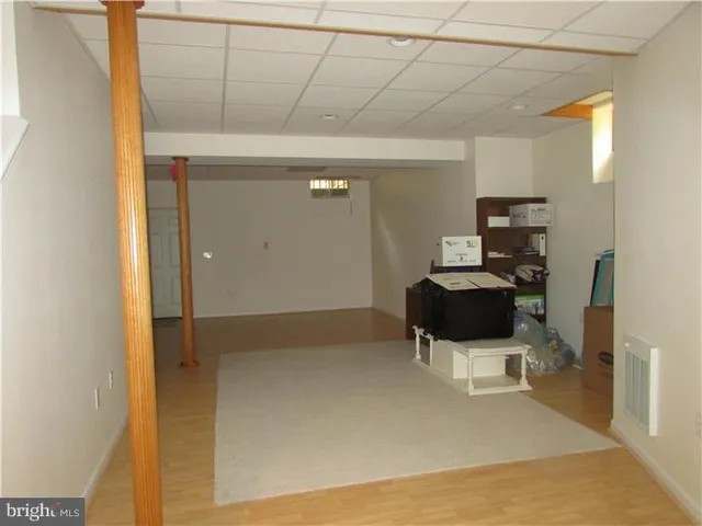 a view of a bathroom with a sink and a mirror
