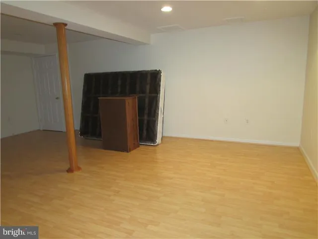 a view of an empty room with a fireplace