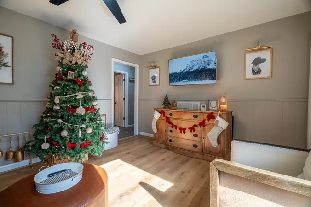 a bedroom with furniture and a potted plant