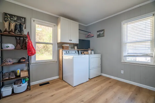 a view of kitchen with window and wooden floor