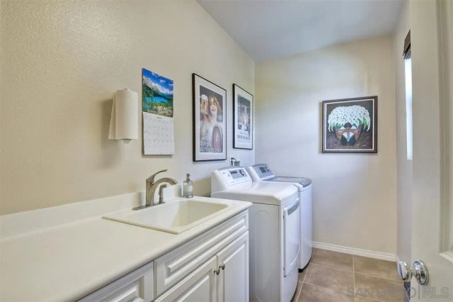 a bathroom with 2 sink and a mirror