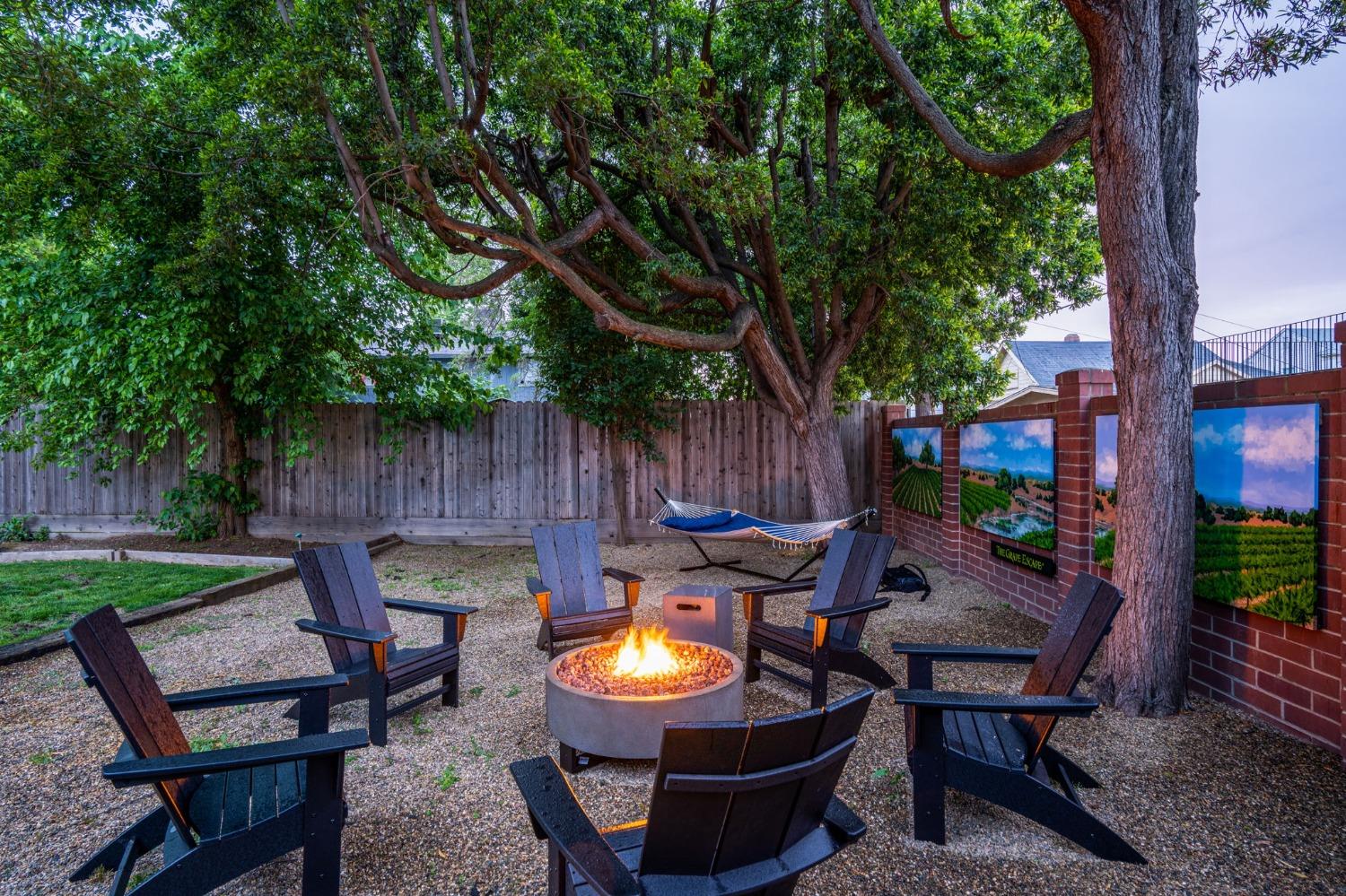 333 West Locust Street Lodi, CA 95240 - Photo 11 of 32 an outdoor sitting area with chairs and a table