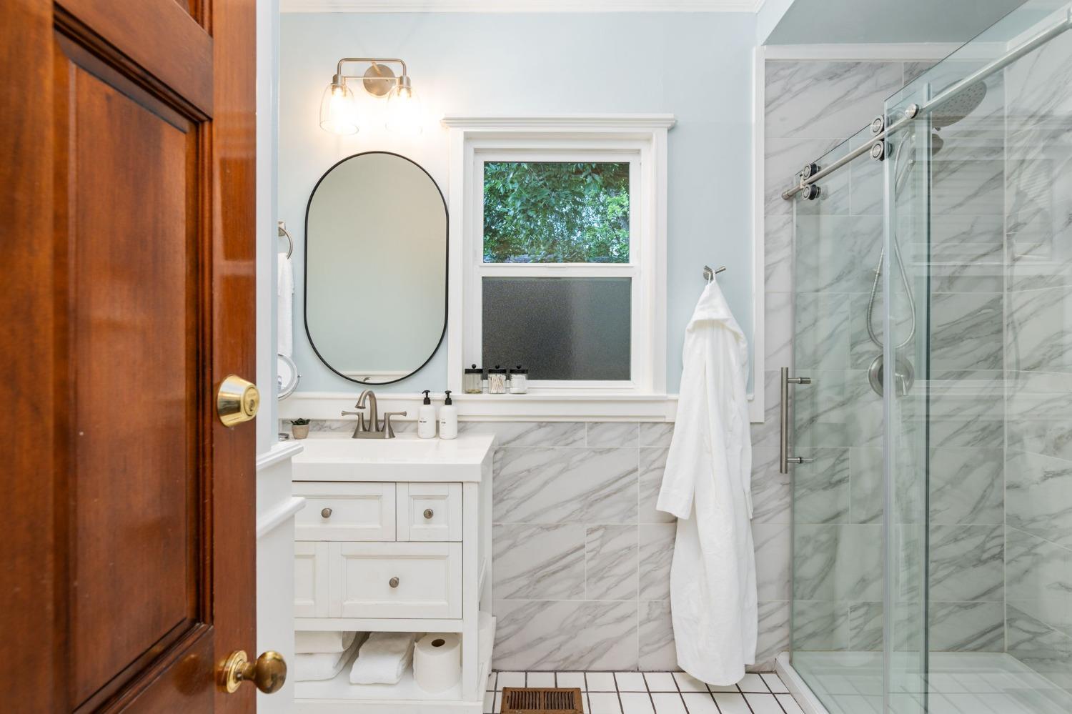 333 West Locust Street Lodi, CA 95240 - Photo 19 of 32 a bathroom with a sink double vanity and a mirror