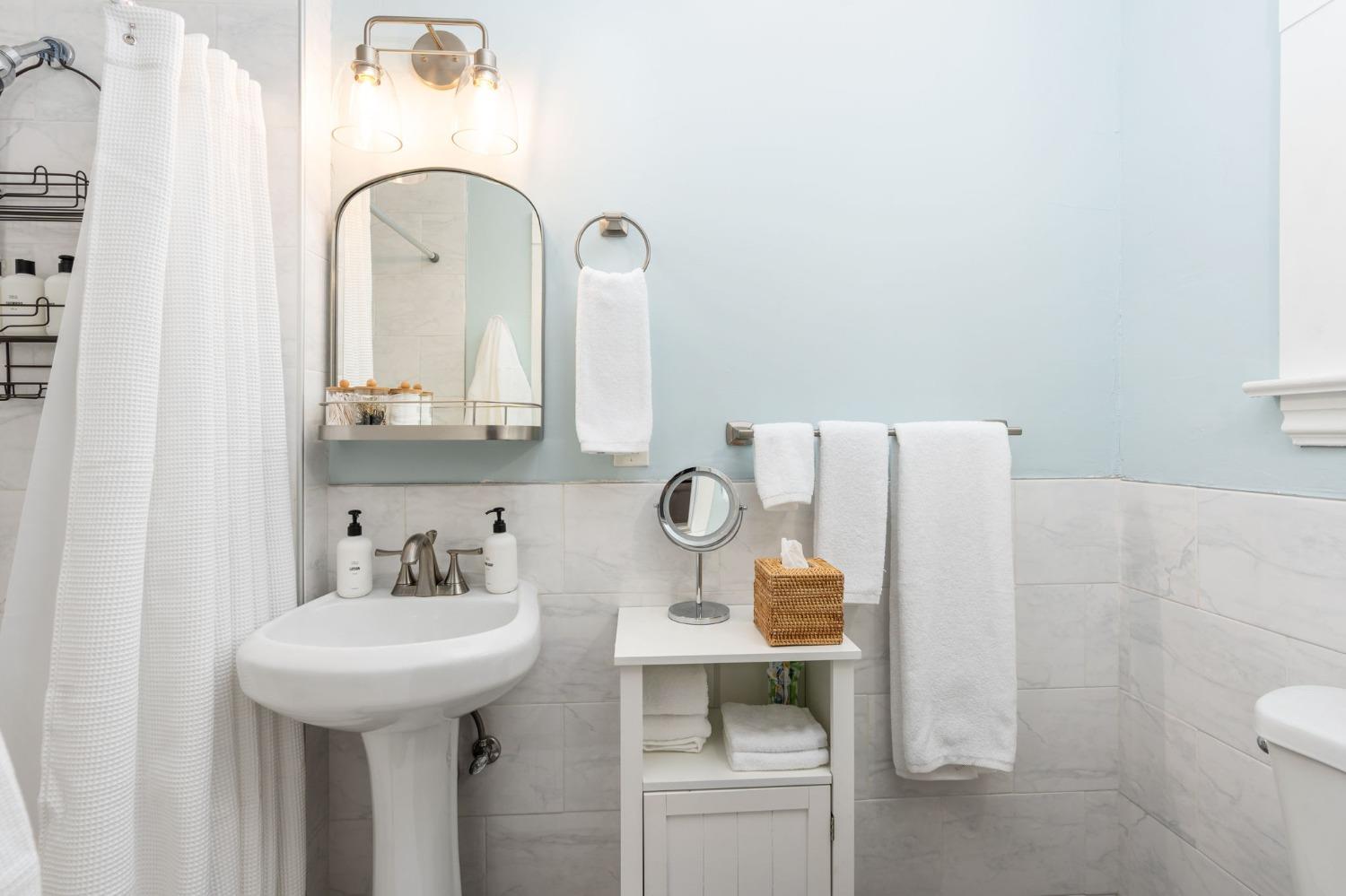 333 West Locust Street Lodi, CA 95240 - Photo 28 of 32 a bathroom with a sink and a mirror