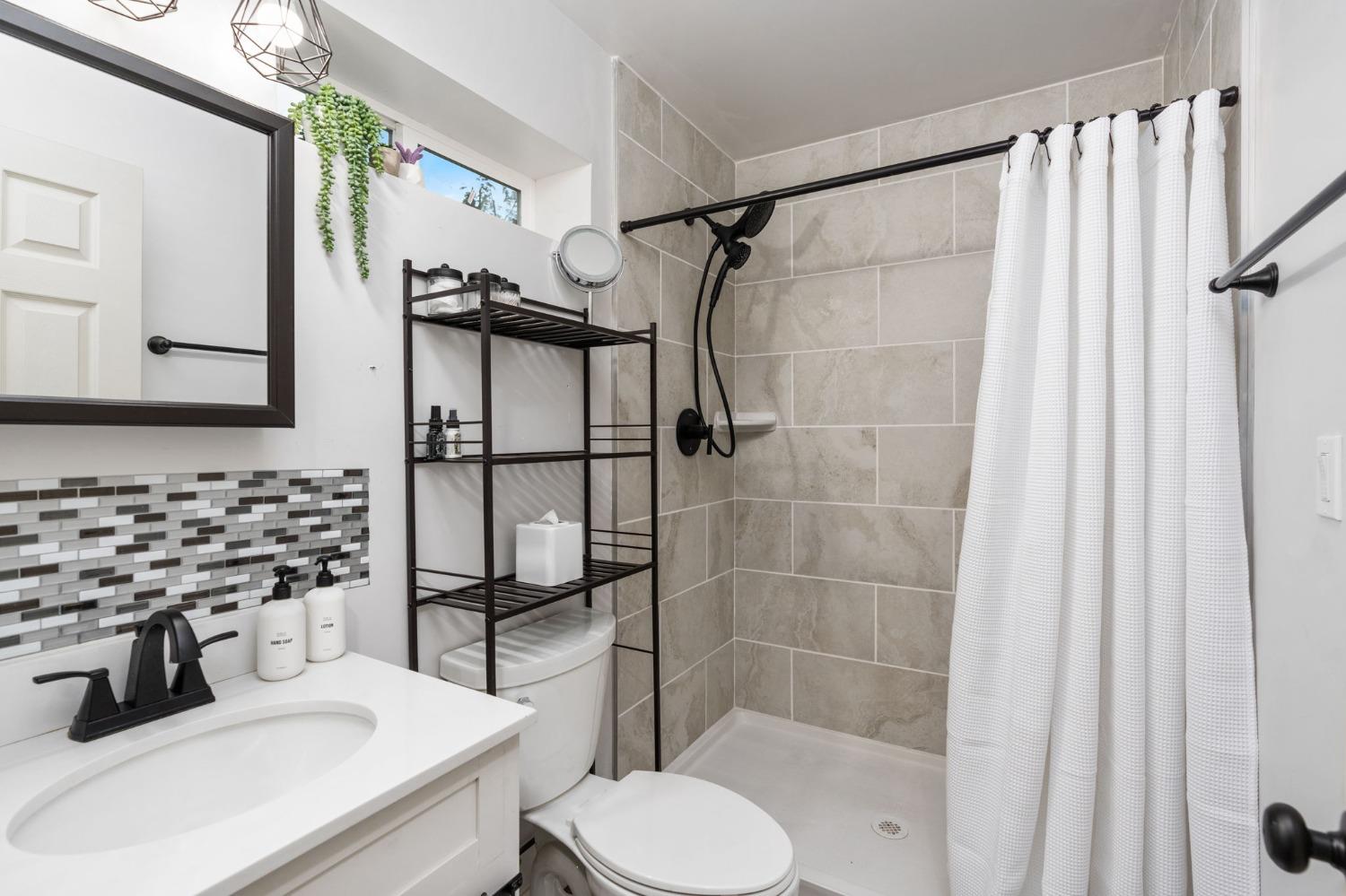 333 West Locust Street Lodi, CA 95240 - Photo 32 of 32 a bathroom with a sink toilet and shower