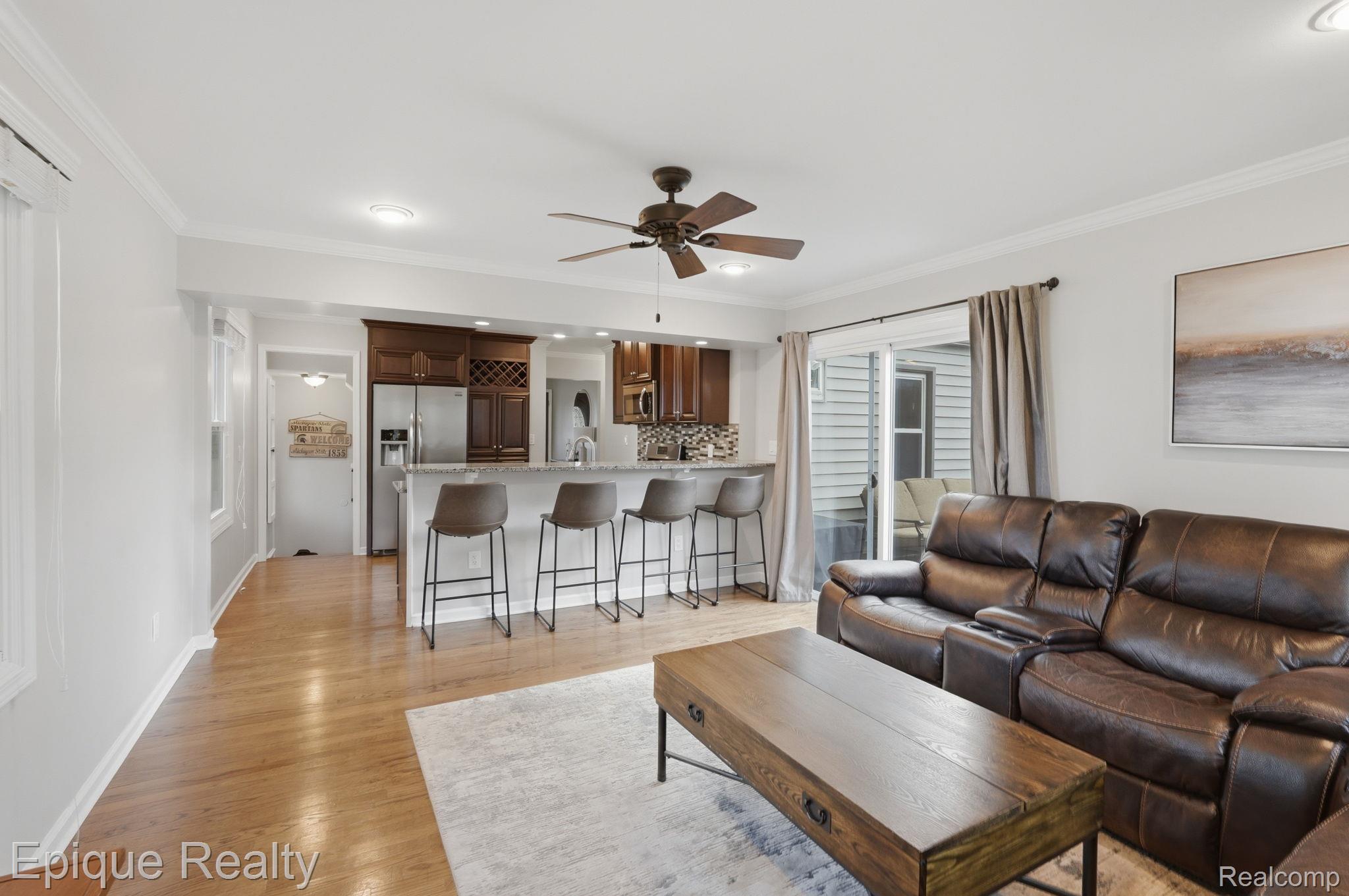 3402 Normandy Road Royal Oak, MI 48073 - Photo 3 of 32 Open-concept living area featuring a breakfast bar open to family room and sliding glass door access to Trex Deck!