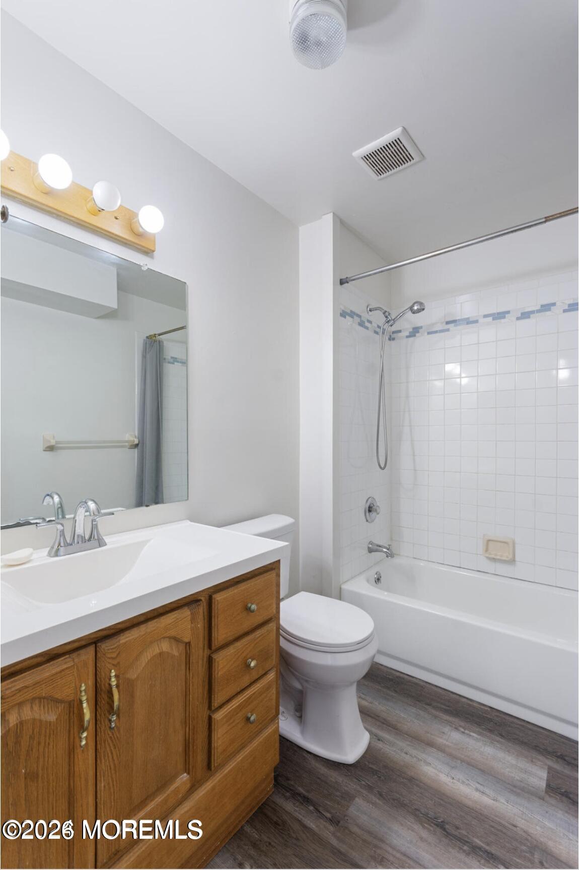 1606 Main Street, Unit R209 Lake Como, NJ 07719 - Photo 14 of 26 a bathroom with a sink toilet and shower
