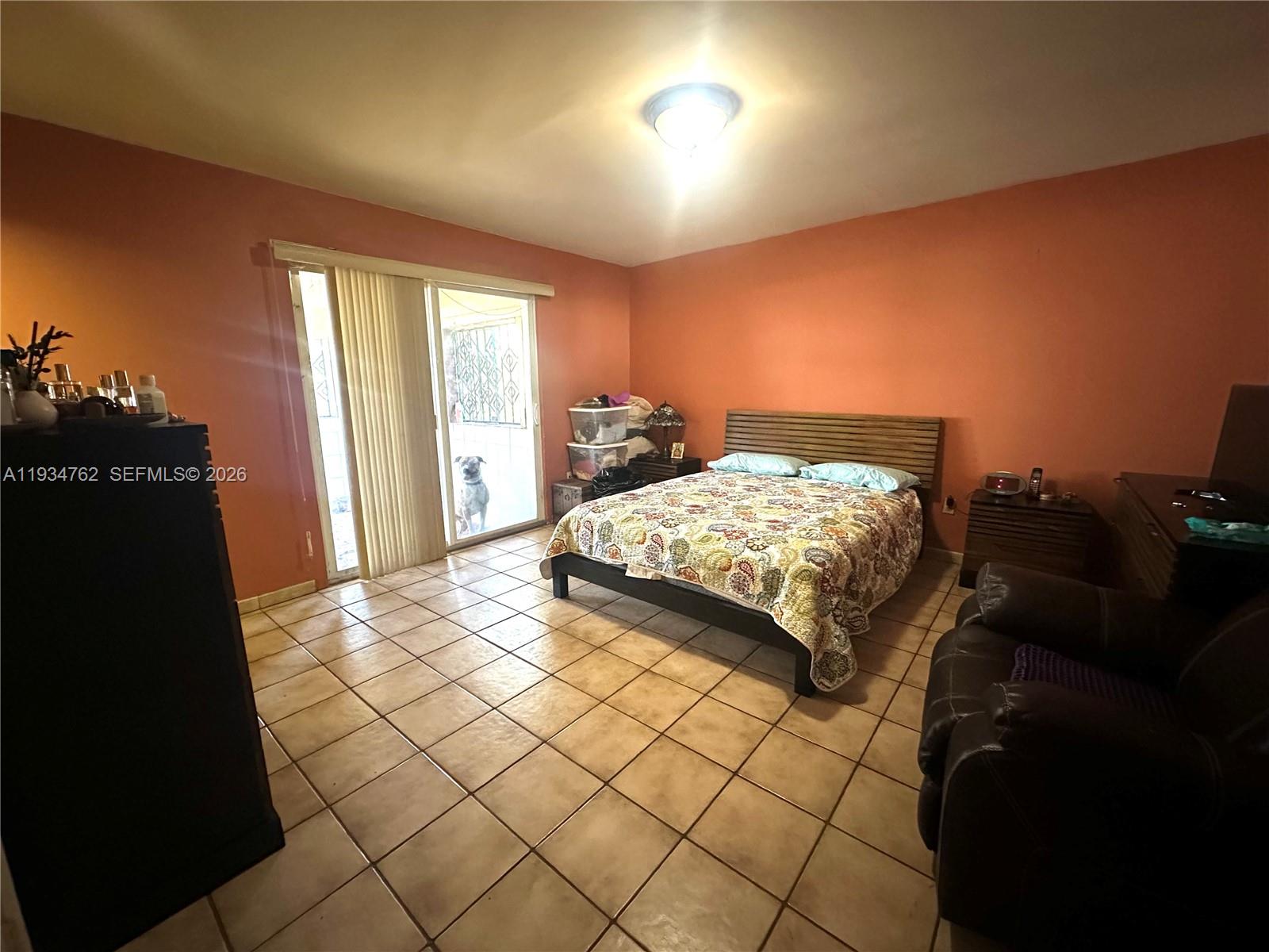 4361 Southwest 3rd Street Miami, FL 33134 - Photo 11 of 24 a bedroom with a bed and a window