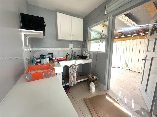 a view of kitchen and sink