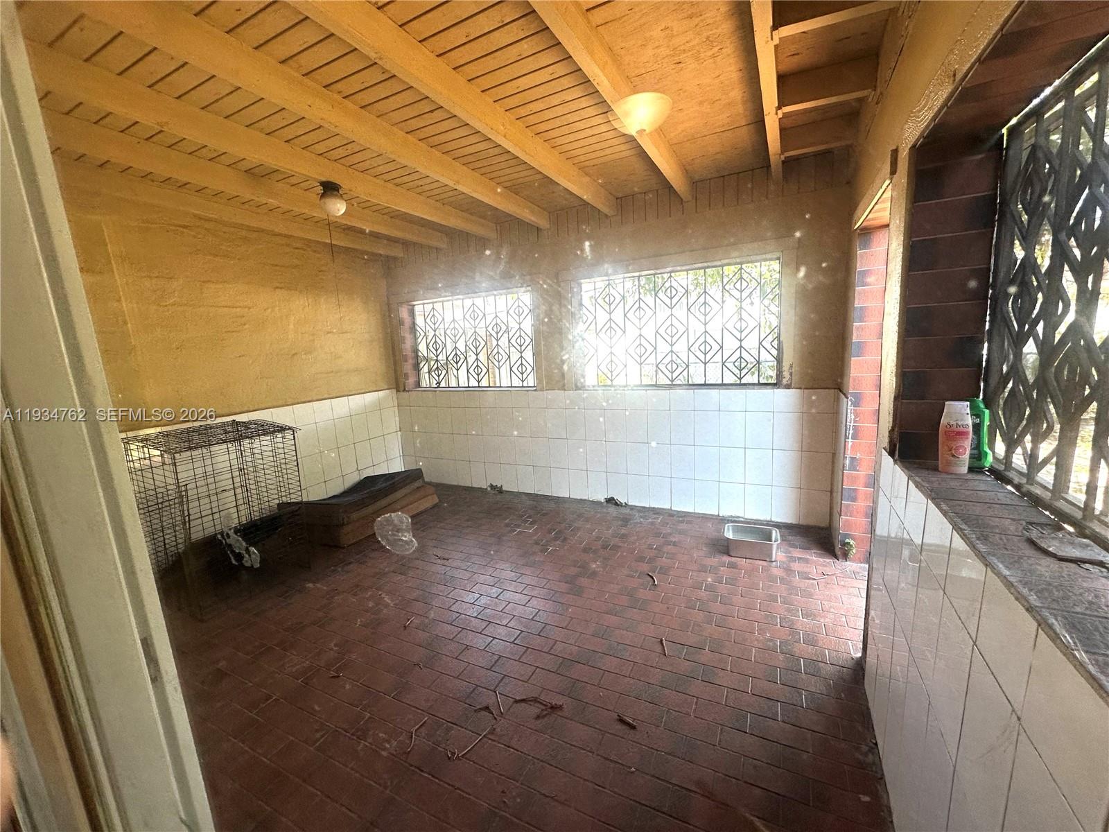 4361 Southwest 3rd Street Miami, FL 33134 - Photo 16 of 24 a view of an empty room with a window