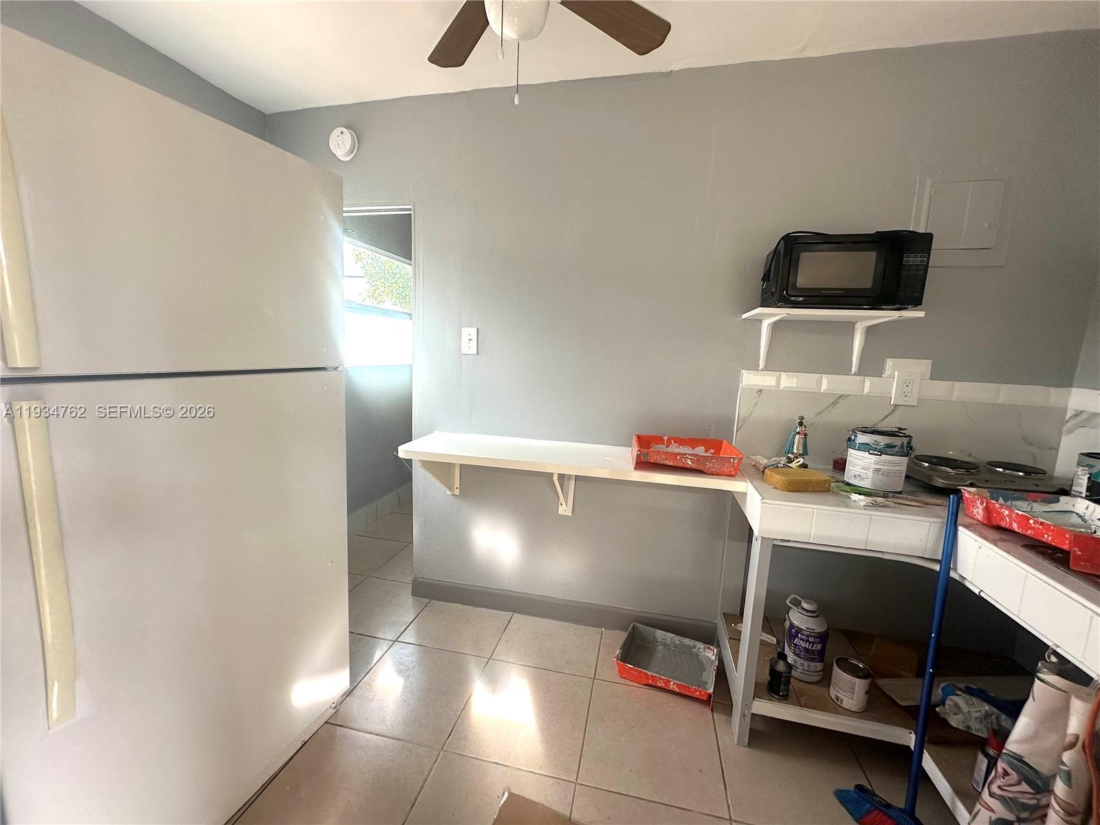 4361 Southwest 3rd Street Miami, FL 33134 - Photo 24 of 24 a room with a refrigerator and a stove