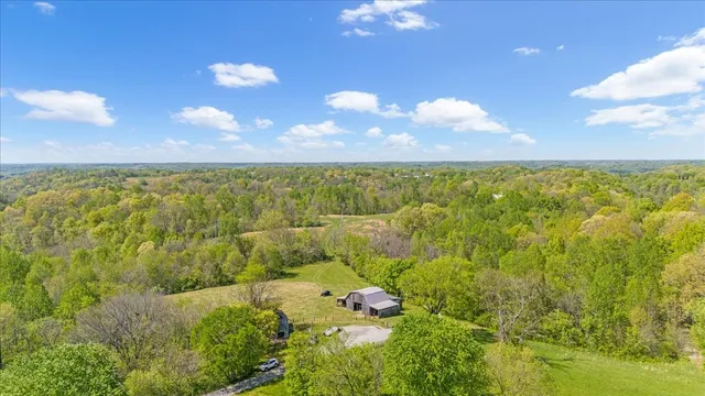 a sunset view with swimming pool and green space