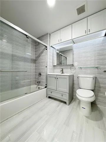 a bathroom with a toilet sink and bathtub