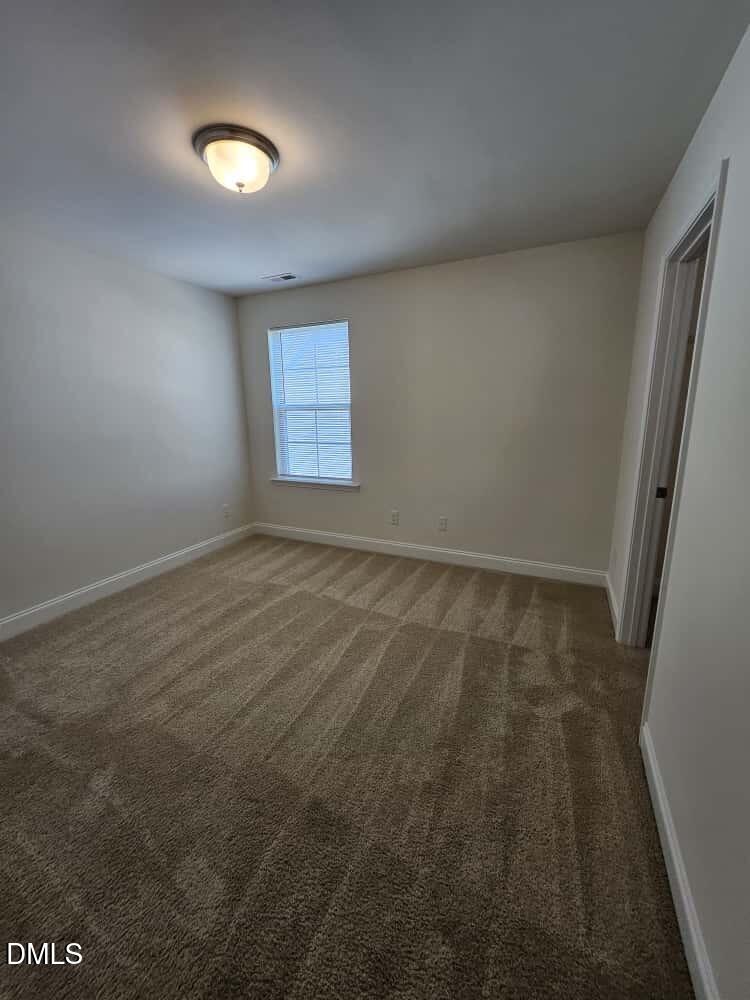 4305 Sir Julian Court Raleigh, NC 27610 - Photo 20 of 25 an empty room with windows