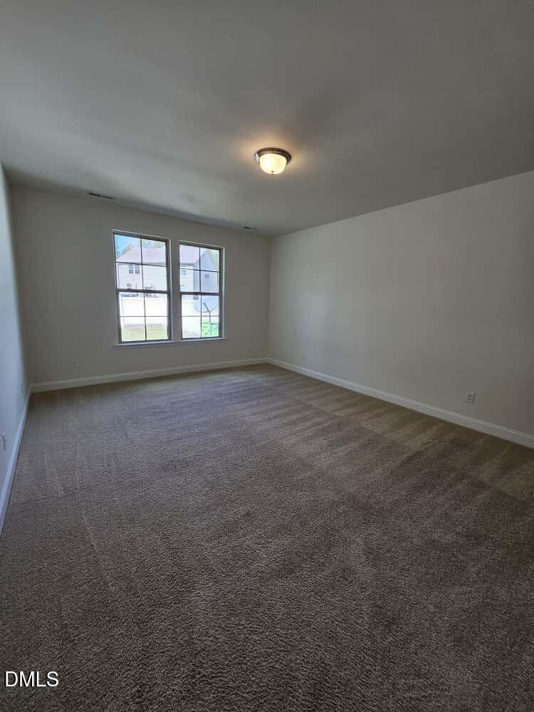 4305 Sir Julian Court Raleigh, NC 27610 - Photo 21 of 25 an empty room with windows