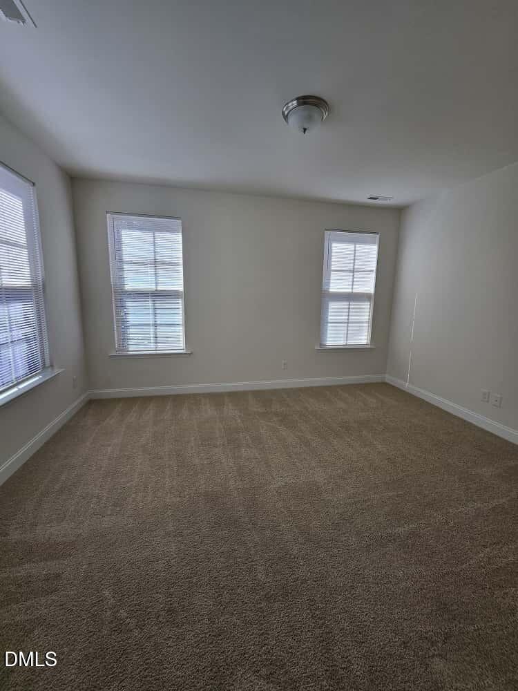 4305 Sir Julian Court Raleigh, NC 27610 - Photo 8 of 25 an empty room with a window