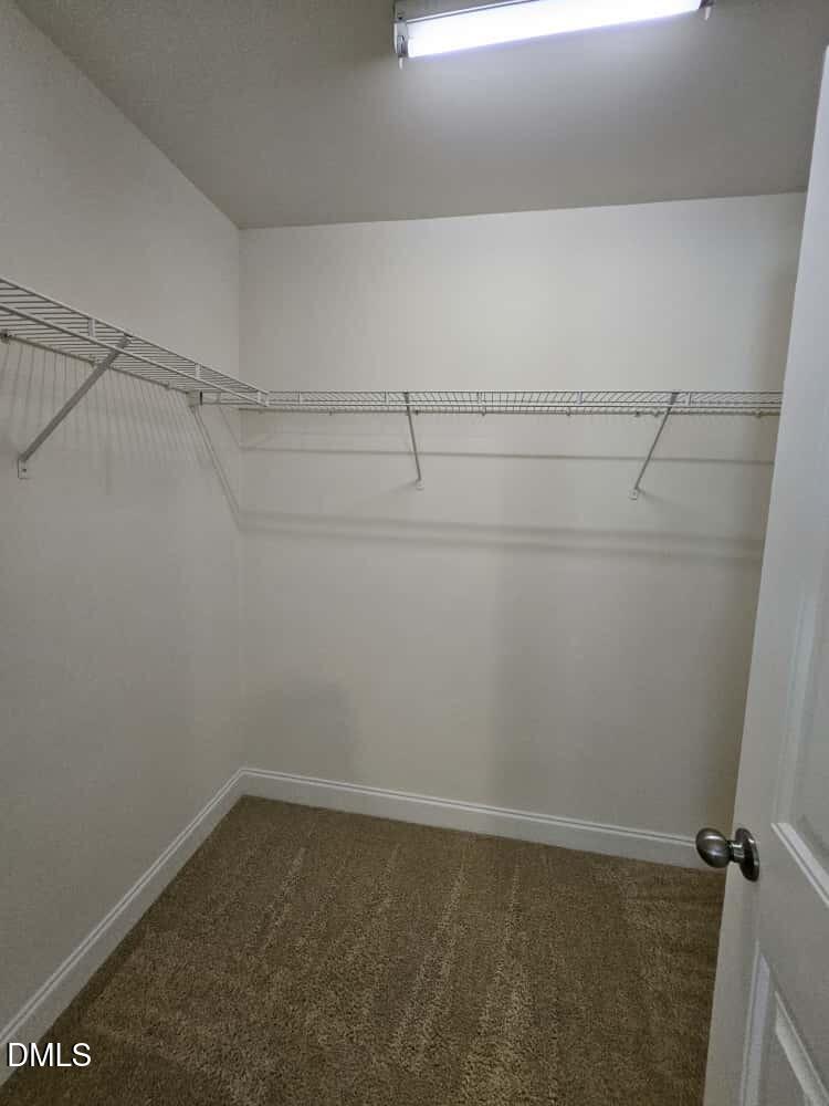 4305 Sir Julian Court Raleigh, NC 27610 - Photo 9 of 25 a view of a room with racks on the wall
