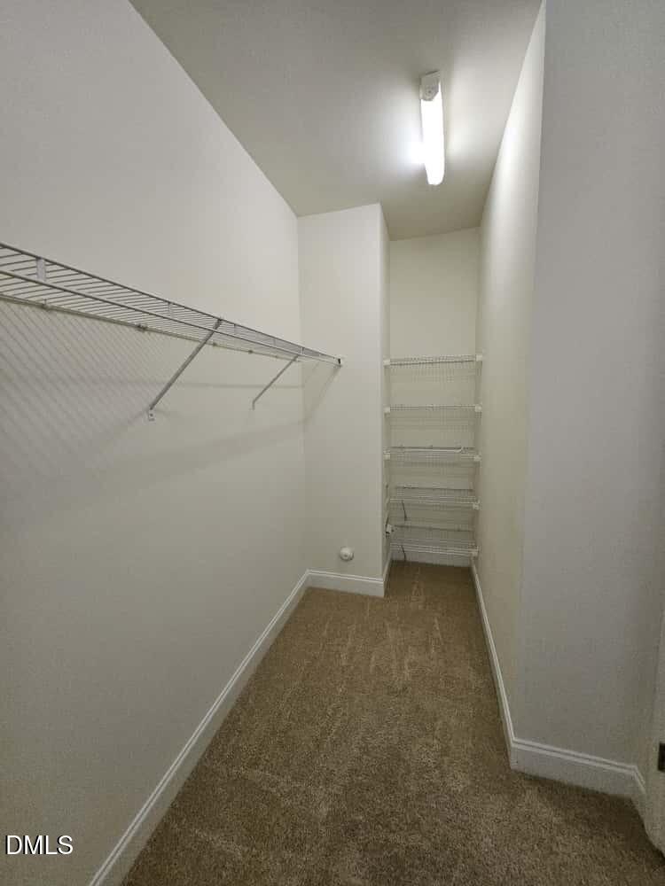 4305 Sir Julian Court Raleigh, NC 27610 - Photo 10 of 25 a view of a room with racks on the wall