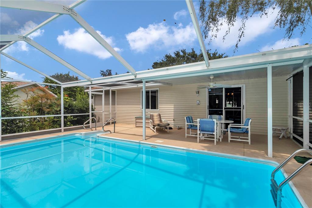 8012 Southwest 109th Place Road Ocala, FL 34481 - Photo 14 of 20 a backyard of a house with outdoor seating