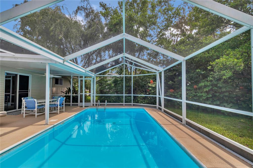 8012 Southwest 109th Place Road Ocala, FL 34481 - Photo 16 of 20 a view of a backyard with a patio and wooden floor