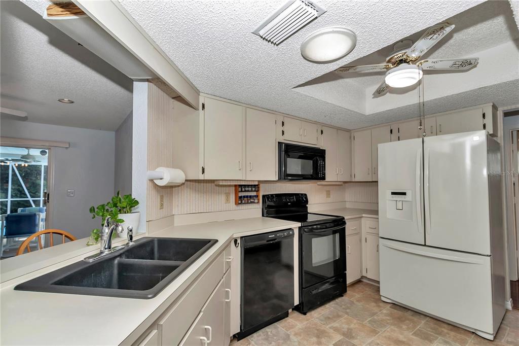 8012 Southwest 109th Place Road Ocala, FL 34481 - Photo 6 of 20 a kitchen with a sink appliances and cabinets