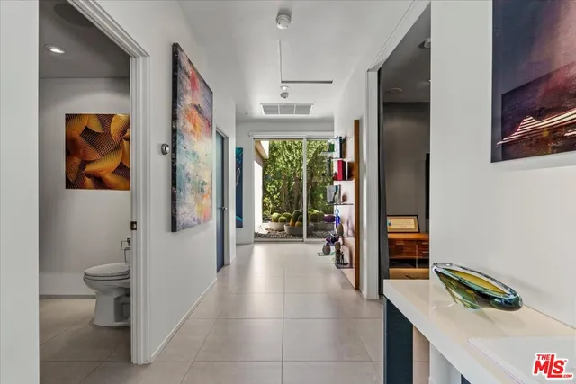 a view of a livingroom with a fireplace and a large window
