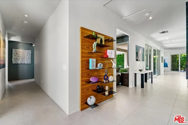 a bedroom with a bed and wall painting