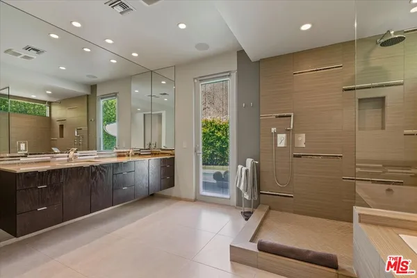 a view of an house with backyard space and patio