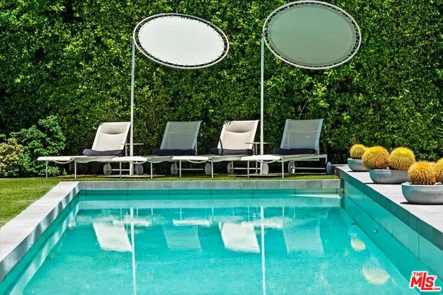 a view of a patio with a table and chairs