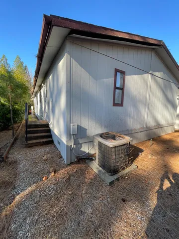 a view of a kitchen with a sink and a window