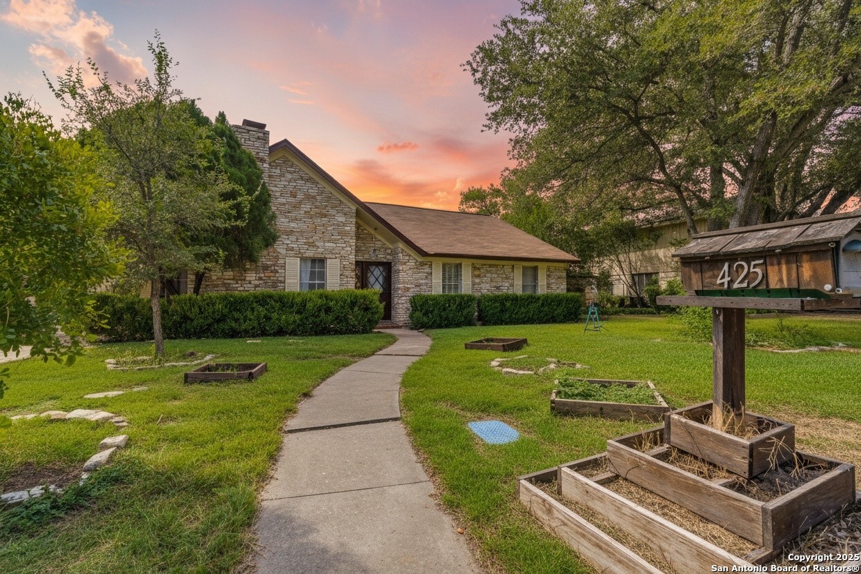 425 Golfcrest Drive Windcrest, TX 78239 - Photo 2 of 26 a view of a house with garden