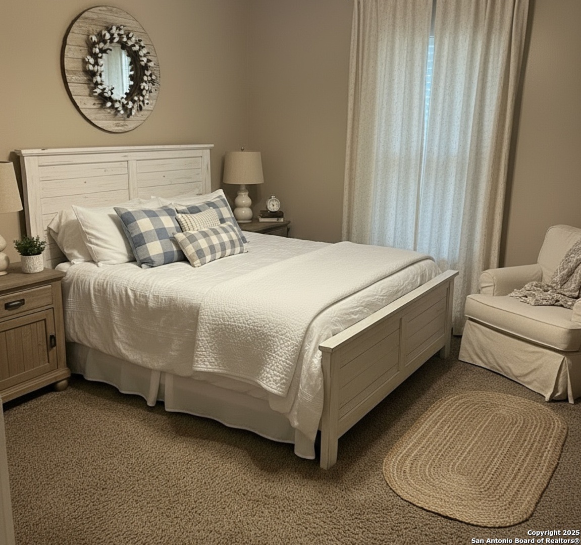 425 Golfcrest Drive Windcrest, TX 78239 - Photo 21 of 26 a bed sitting in a bedroom next to a window and a chandelier