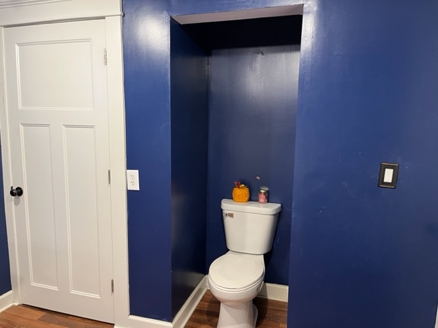 606 North 3rd Street Rochelle, IL 61068 - Photo 13 of 36 a white toilet sitting next to a bathroom sink