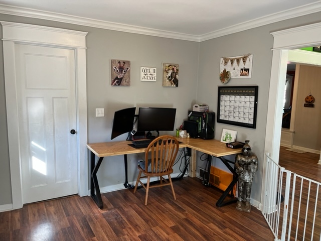 606 North 3rd Street Rochelle, IL 61068 - Photo 14 of 36 a workspace with furniture and wooden floor