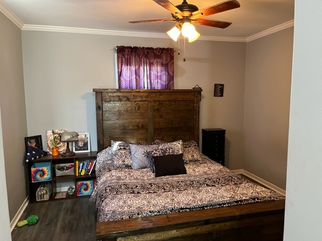606 North 3rd Street Rochelle, IL 61068 - Photo 16 of 36 a bedroom with a bed and a chandelier