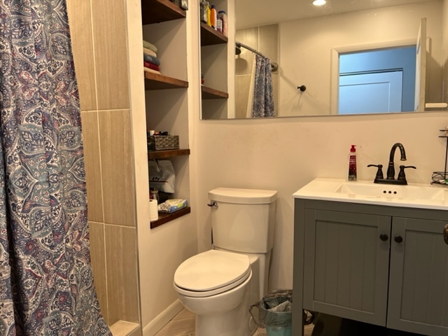 606 North 3rd Street Rochelle, IL 61068 - Photo 17 of 36 a bathroom with a sink toilet and shower