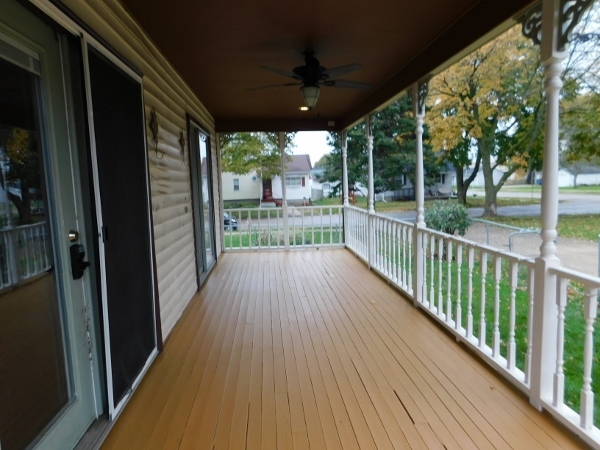 606 North 3rd Street Rochelle, IL 61068 - Photo 3 of 36 a view of a porch with wooden floor and outdoor space
