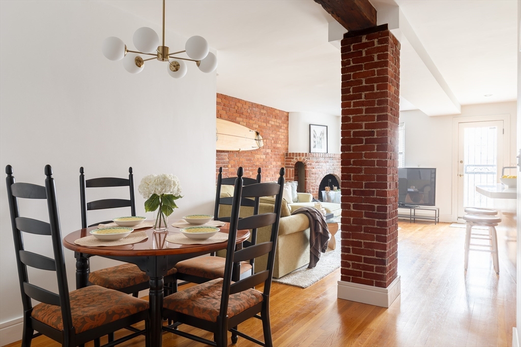 193 St Botolph Street, Unit 1 Boston, MA 02115 - Photo 4 of 15 a view of a dining room with furniture window and wooden floor