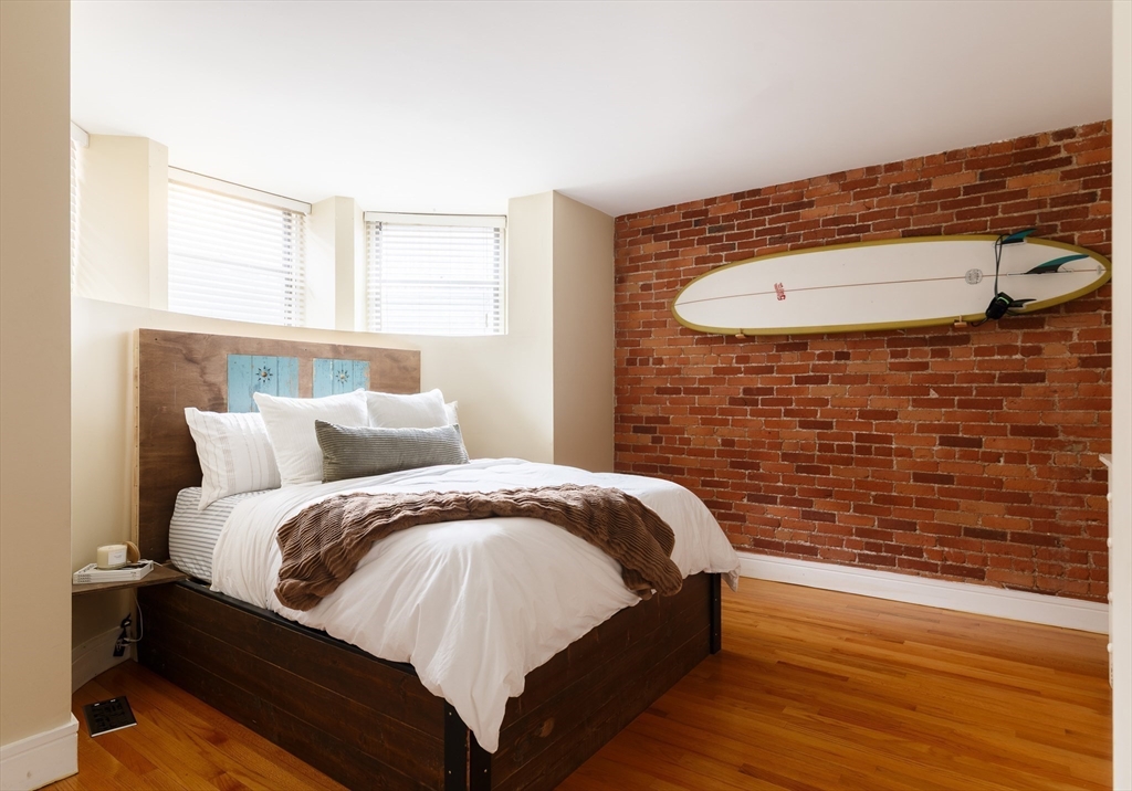 193 St Botolph Street, Unit 1 Boston, MA 02115 - Photo 5 of 15 a bed room with a bed and a window