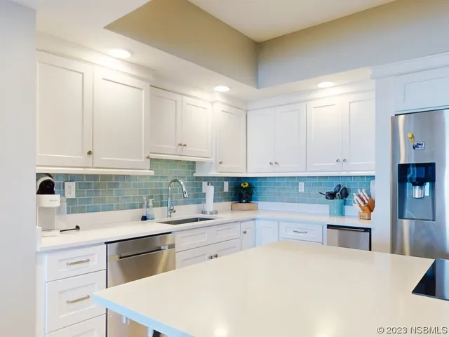 a view of a dining room with furniture and window