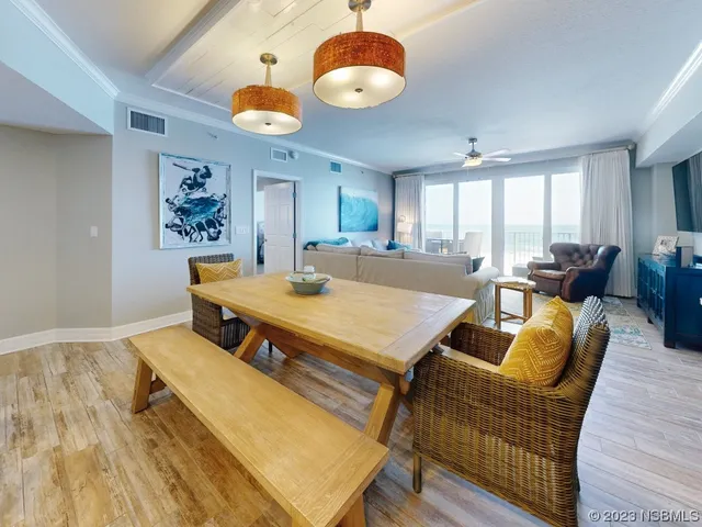 a dining room with a table and chairs
