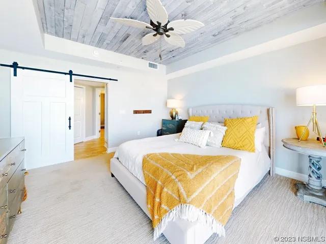 a spacious bathroom with a double vanity sink a mirror and a