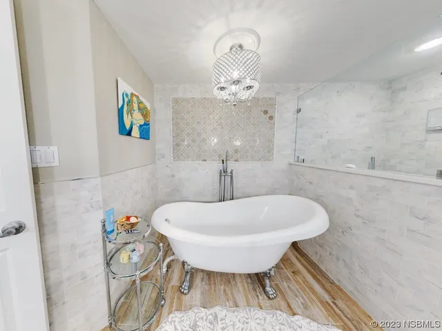 a spacious bathroom with a granite countertop sink and a mirror
