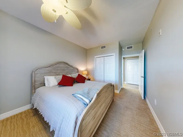 a kitchen with a stove a sink dishwasher and a refrigerator with wooden floor