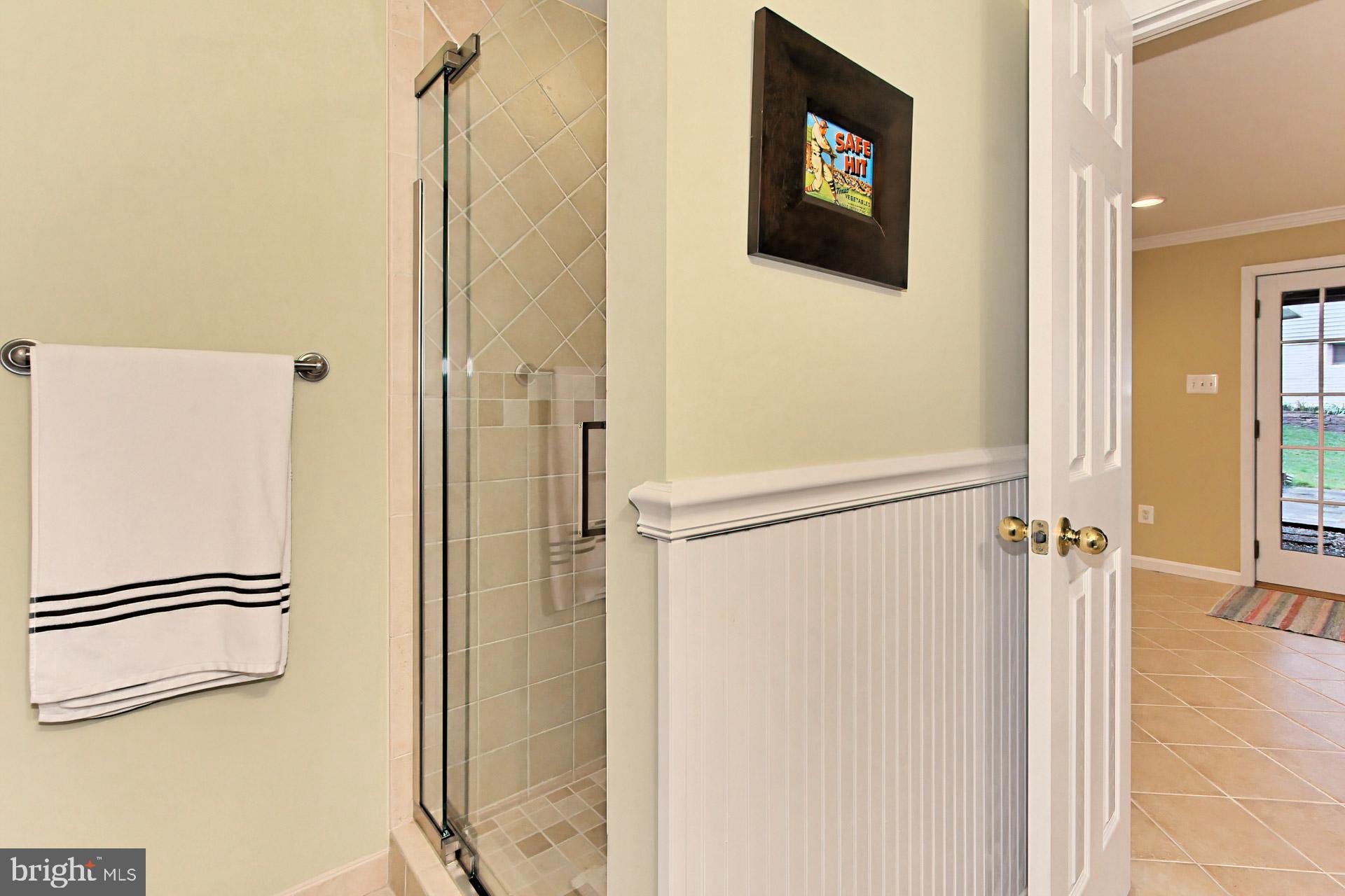 8126 Ridge Creek Way Springfield, VA 22153 - Photo 35 of 50 a bathroom with a shower and a shower