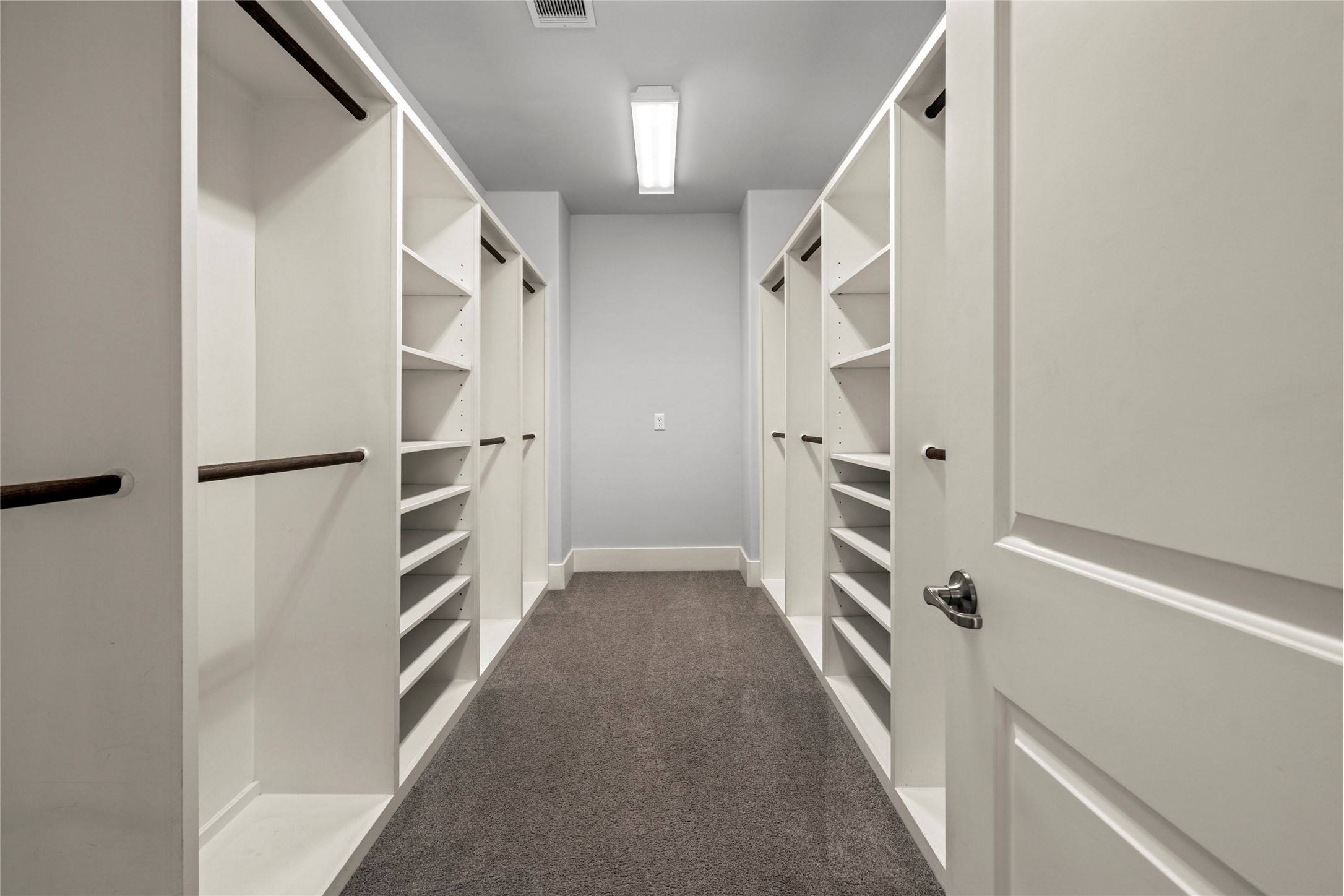 5646 Larkin Street Houston, TX 77007 - Photo 10 of 29 A spacious walk-in closet with extensive built-ins for organization.