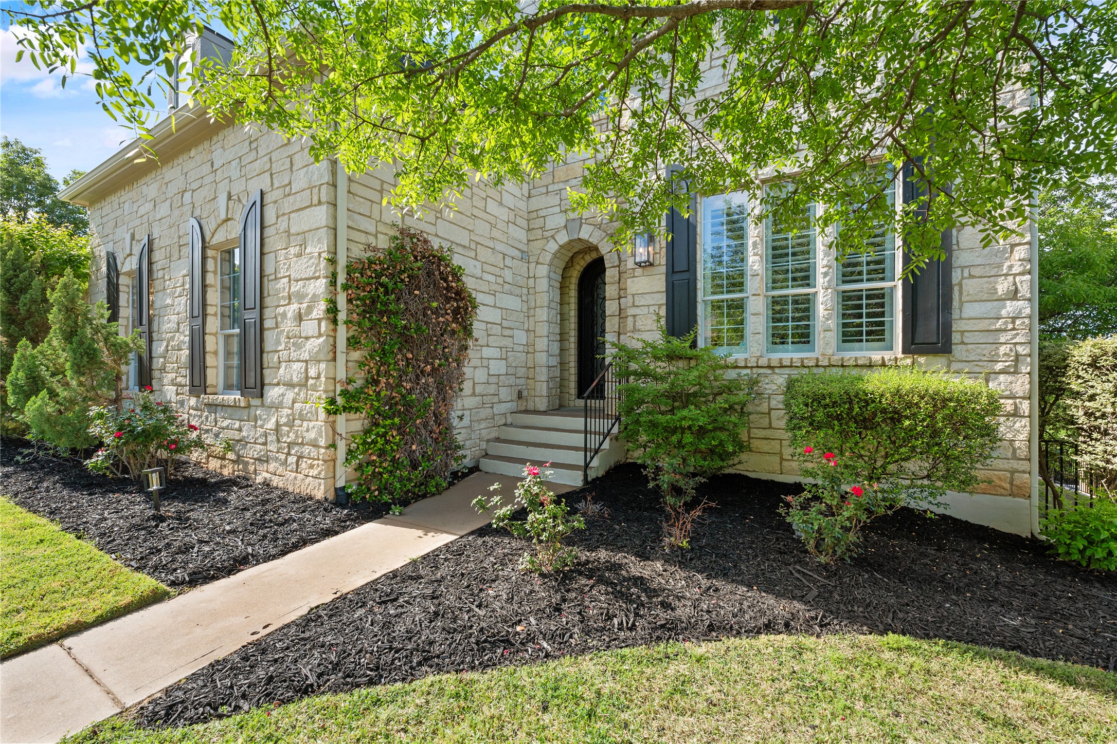 115 Burgess Lane Austin, TX 78738 - Photo 1 of 1 a view of a house with a yard and large tree
